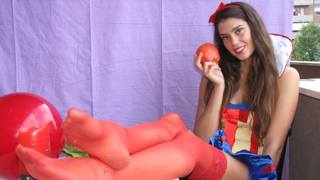 Sweet sexy Carla with flawless orange stockings in a Snow-White cosplay costume